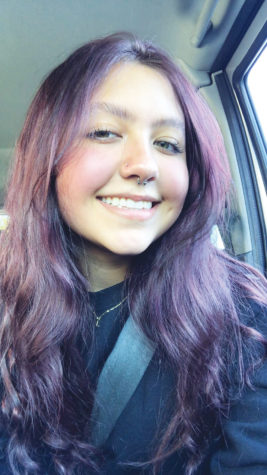 Nataly Edgerly-Arciga, seen here smiling in her car, co-founded the Naches Valley High School GSA club.