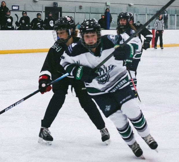 Freshman Emma Nodello skates past an opposing player. Nodello is part of a team based in Seattle and practices in Vancouver. (Photo courtesy of Emma Nodello)