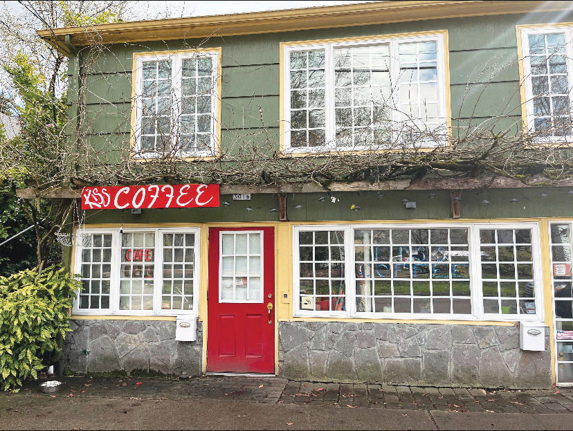 Kiss Coffee’s rustic and flowery exterior. The shop was purchased in 2019 and offers many pastries and drinks.