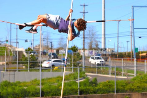 Junior Miles Green pole vaulting at practice. He is one of the athletes that competed in state.