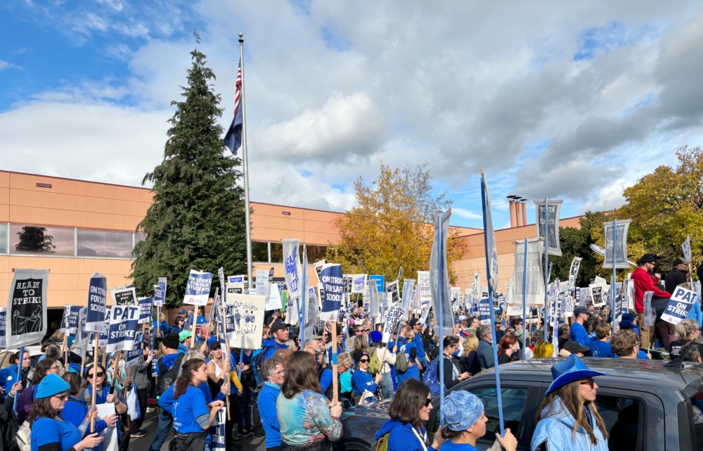 The rally outside of the district office on Nov. 2. Many attendees are wearing blue to show solidarity with the teachers union.