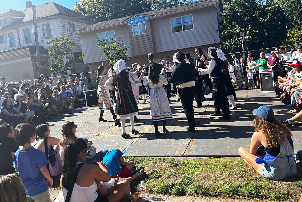 A group dances to upbeat music right outside the festival entrance. Everyone there is paying a lot of attention to the dancers. This was the 70th annual festival that went from Oct. 6-8, located at the Holy Trinity Greek Orthodox Cathedral on NE Glisan St. 