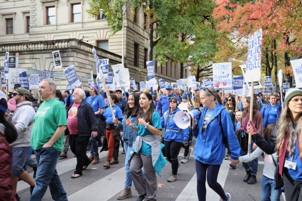Students, parents and educators round the corner to city hall while marching during a teachers strike demonstration in downtown Portland. The strike lasted for 11 school days overall, beginning on Nov. 1 and ending when PPS and PAT came to a tentative agreement on Nov. 26.