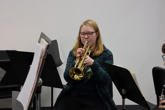 Sofia Crafts practicing a trumpet part during Jazz Band. Crafts has been a student conductor since the beginning of this school year.