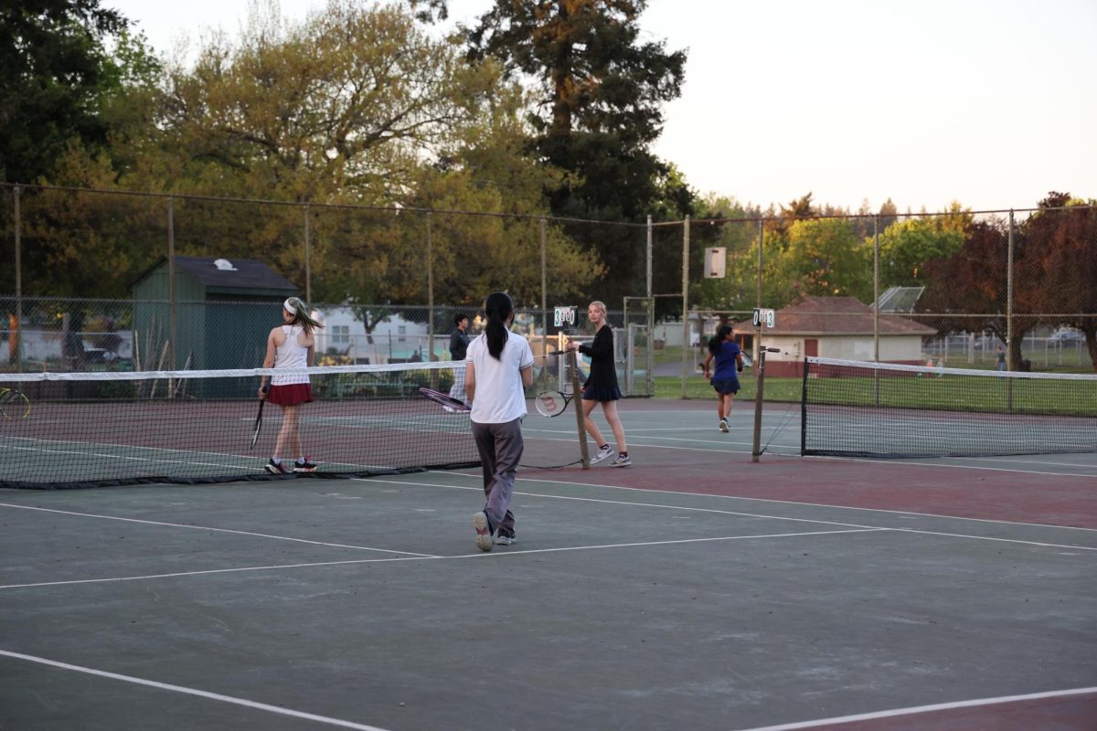 The+girls+tennis+team+runs+drills+on+the+court+at+Glenhaven.+The+team+has+had+a+good+turnout+this+year%2C+with+over+50+players+signing+up.