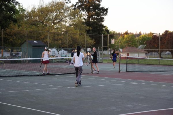 The girls tennis team runs drills on the court at Glenhaven. The team has had a good turnout this year, with over 50 players signing up.