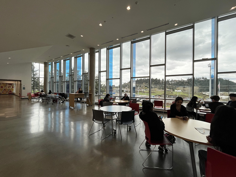 The bright window on the balcony overlooking the commons. The sunlight beams through this big open window.