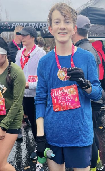 This photo was taken after my finish at the Foot Traffic Holiday Half 10k race on Dec. 10, 2023. Although it was a dreary, cold day, I had a lot of fun in the celebratory atmosphere.