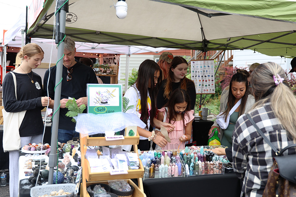 Many fairgoers gather around the Crystal Inclusions shop owned by Susan Mcauley. This shop features anything from crystals shaped like Pokémon to crystals shaped like ghosts, dragons, pumpkins, coffins and spiders. “Everybody loves the crystals,” Mcauley said,  and she mentioned how she enjoyed getting to meet the wide variety of customers. You can learn more about Crystal Inclusions on Instagram @Suzans_crystal_inclusions. It’s the company’s second year participating in the Belmont Street Fair, and they look forward to participating in the years to come. 