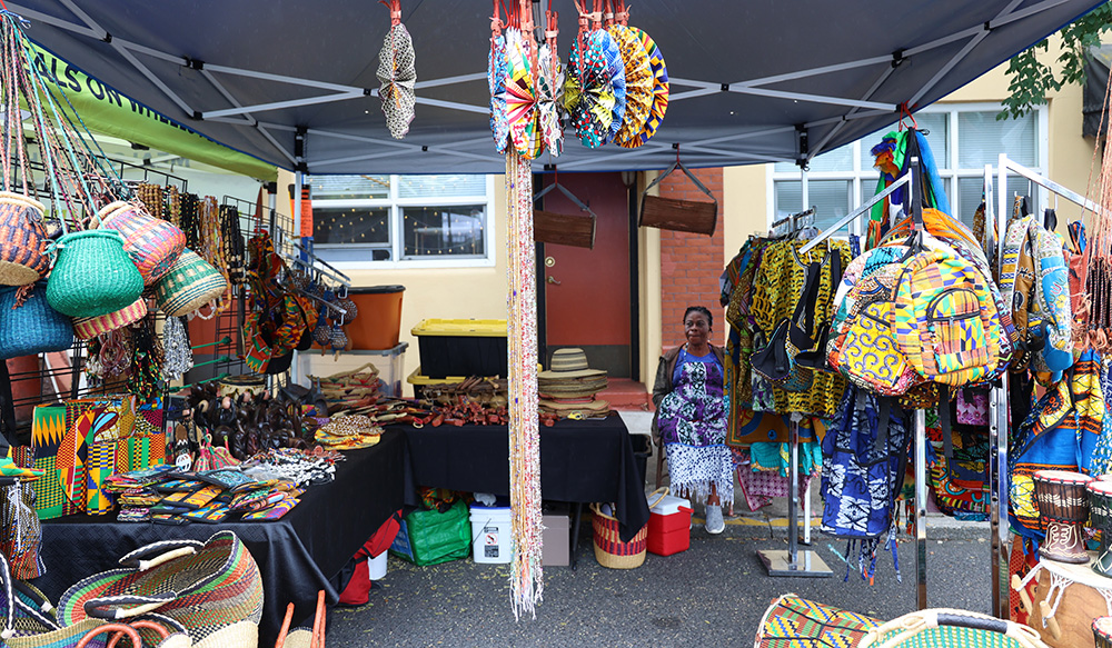 Kweki African Fashions, owned by Patience Ward who can be seen sitting towards the back right of the booth, displays a variation of different clothes, drums, shakers, baskets and carvings that originate from Ghana, Africa. Ward mentioned that she loves how the fair brings the community together and how everyone is always nice to each other. 