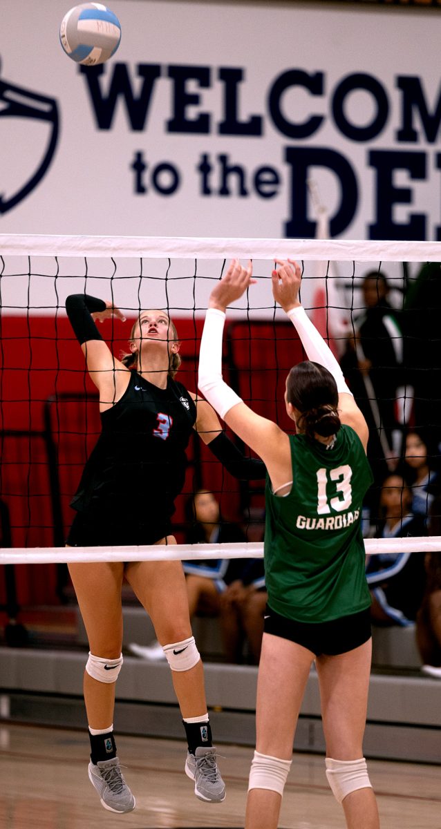 Sophomore Laney Ivester jumps up for a kill and a point. Ivester is one of the younger players in the program that have helped the team succeed.