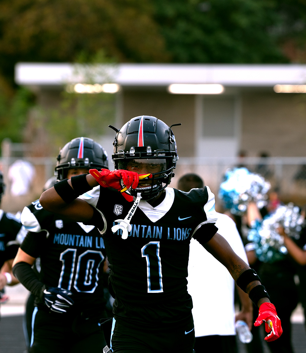 Junior Tre'Marion Crawford celebrates while walking on the field. This is Crawford's third season, and he is one of the team captains this year.