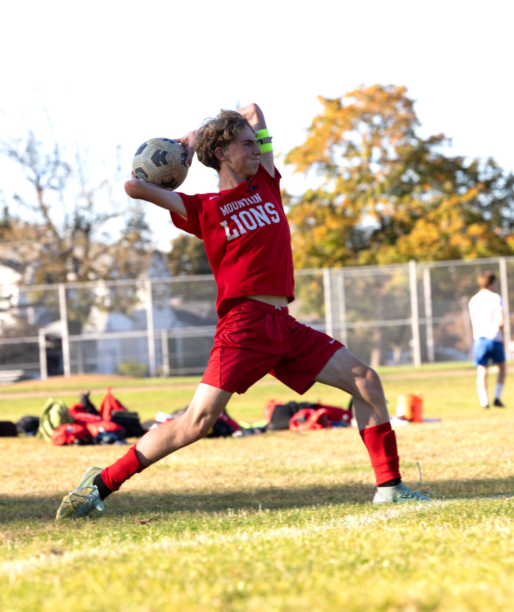 Freshman Cylas Ostrand throws the ball in with force. He is one of the JV2 captains this year.