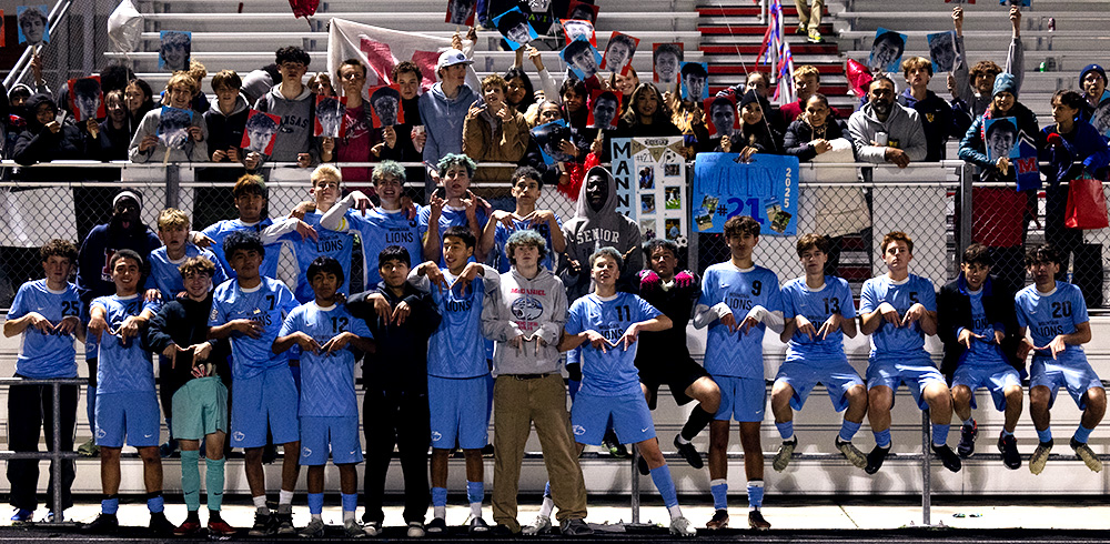 Varsity team celebrates with an "M-Way" celebration.