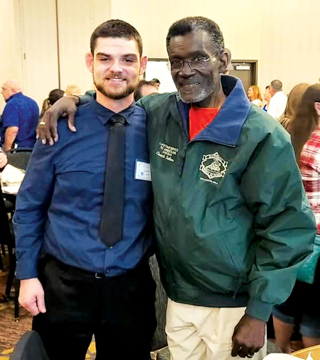 Photo courtesy of McDaniel Wrestling:

Head wrestling coach Emilio Salas and assistant coach Kale Holt pose for a picture. Holt accompanied Salas in the event where they inducted Salas in the Wrestling Hall of Fame.