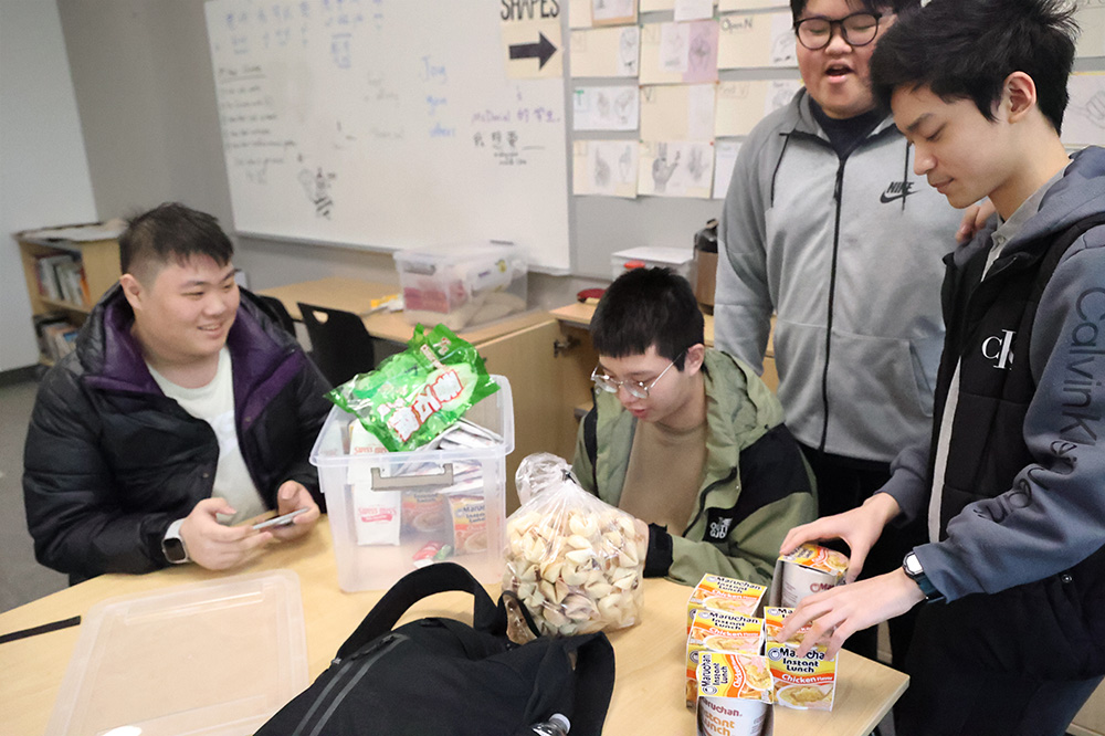 Freshmen Yongzheng Yu, Ziwei Huang, Jackson Chen and Junior Juecheng Yang make ramen together. Making food is a part of the Chinese Club. 