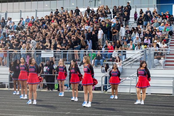 Cheer team is ready to take the stage and fill the stands with school spirit.