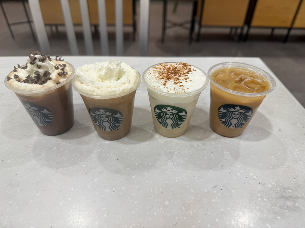 From left to right, the Iced Peppermint Mocha, Iced Caramel brûlée, Iced Gingerbread chai, and Iced Sugar Cookie latte. All featured in 3oz cups.