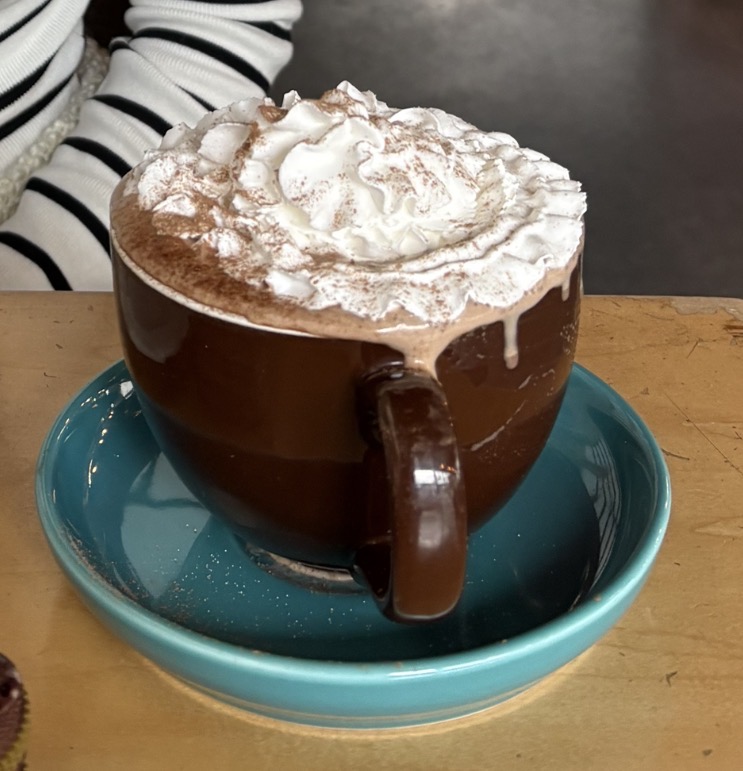Sipping on the best hot cocoa from Jim & Patty’s—warm, sweet, and exactly what winter is all about with every rich sip wrapping you in comfort and warmth, making the experience enjoyable and definitely worth it.

