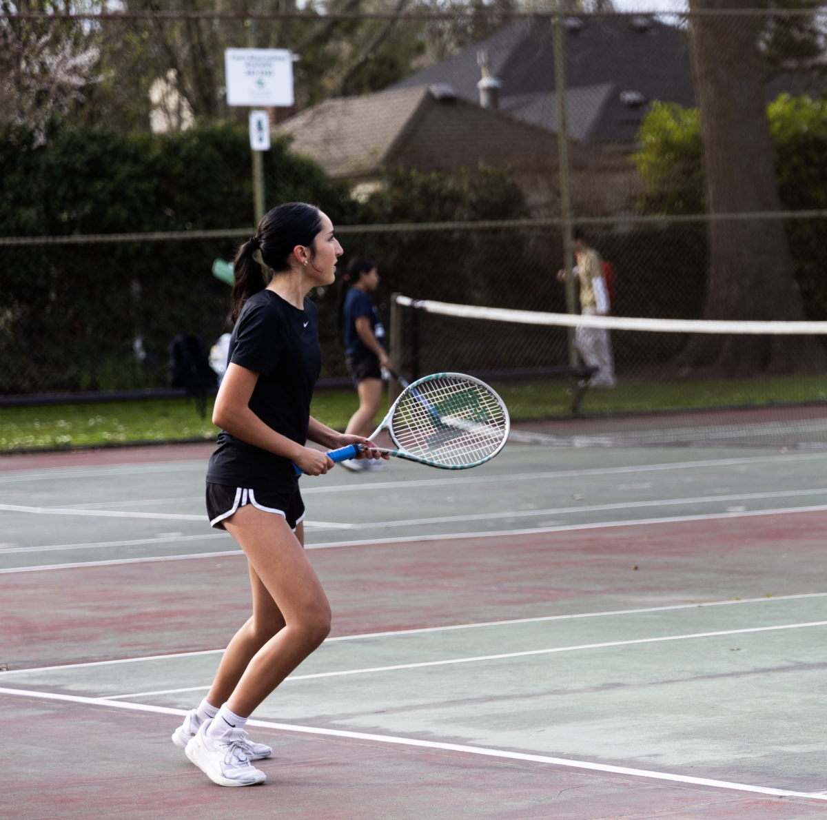 Junior Natalia Fernandez watches McNary’s pair receive the ball after serving them the ball. She is confident that her doubles partner Sanchez will be ready to make a 